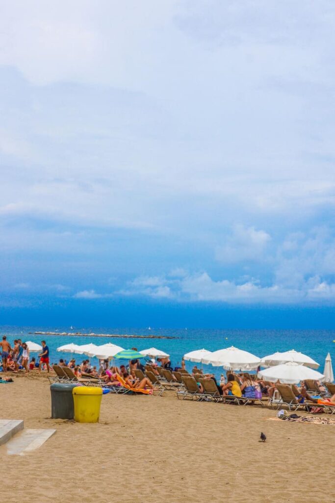 tourists in the beach of Barcelona in July