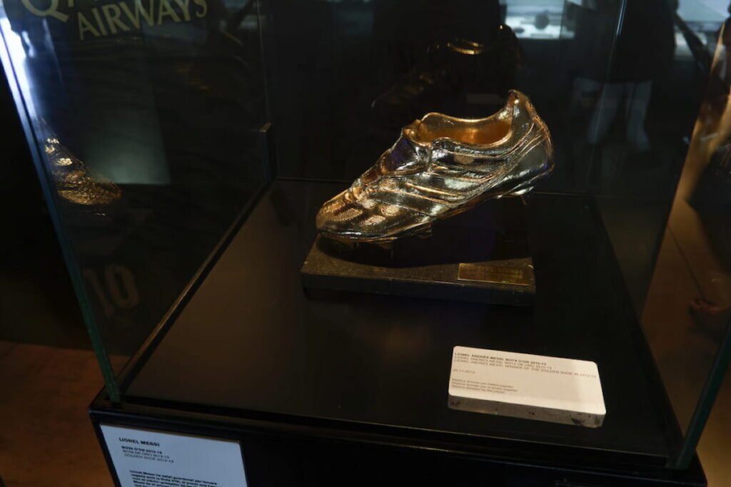 gold replica shoe of Lionel Messi in FC Barcelona Museum one of the best Barcelona museums