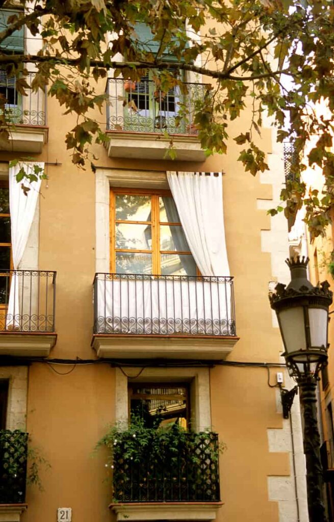 the mild weather allows inhabitants to hang their curtains in barcelona in september