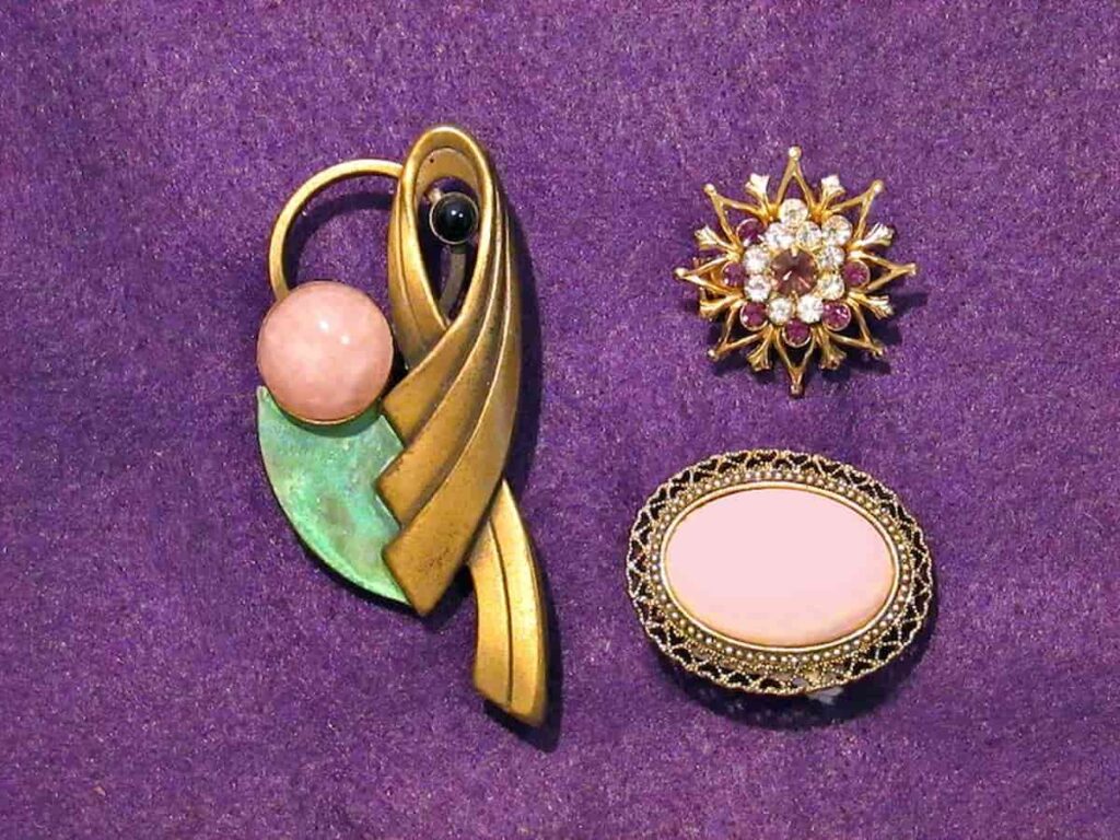 modernist brass brooch with painted leaf and pink glass cabochon in barcelona souvenirs.