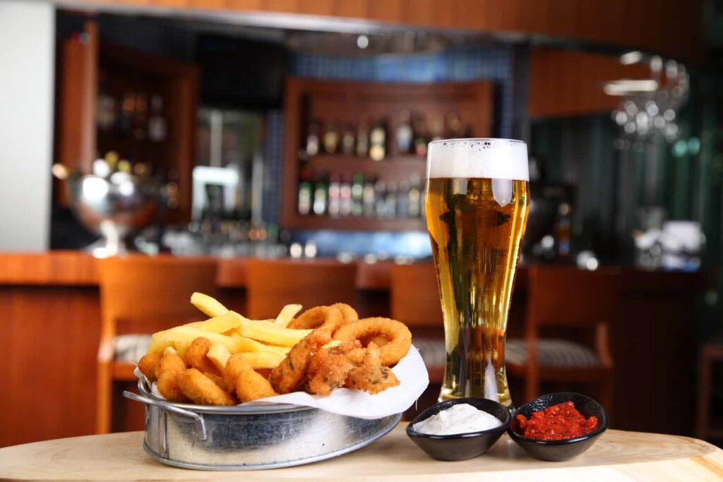 Calamares a la Romana with a glass of beer in barcelona food