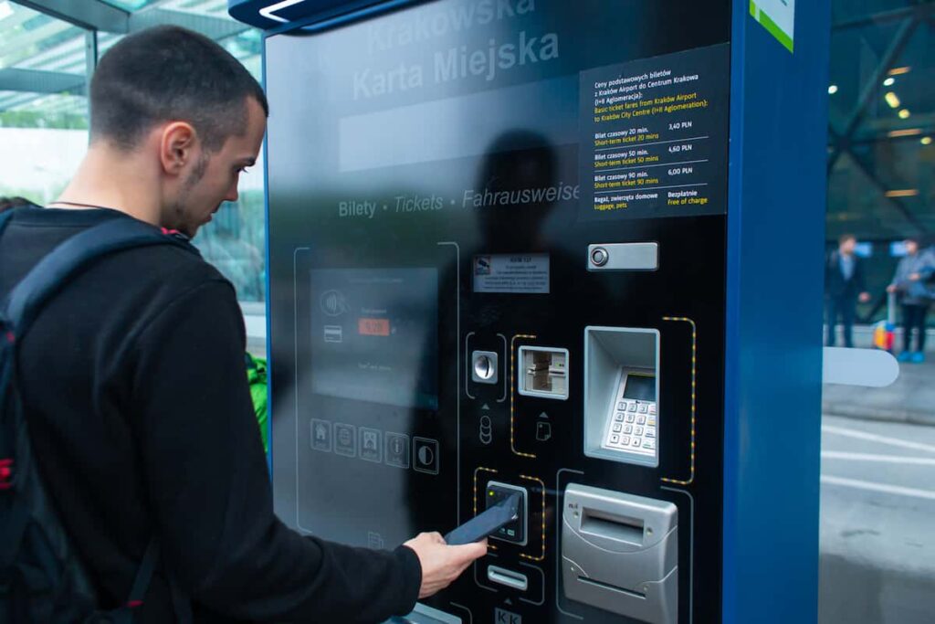 A tourist guy buys a bus ticket for the first time