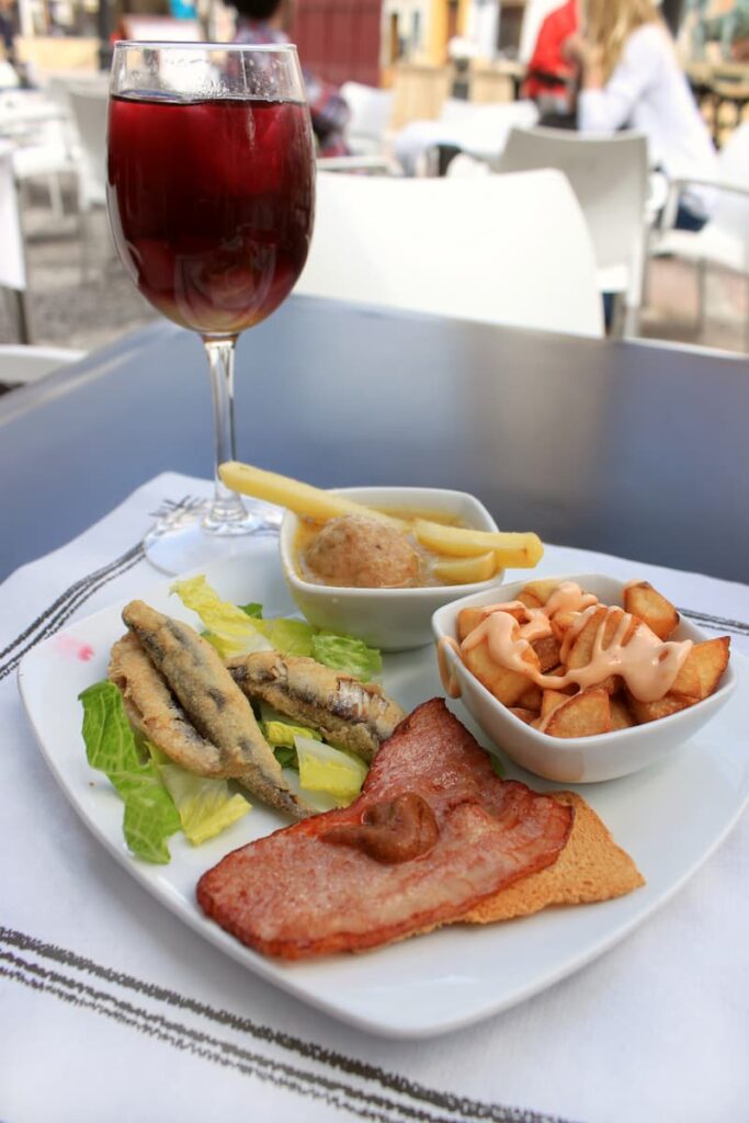  tapas and wine served at a Barcelona tapas tour

