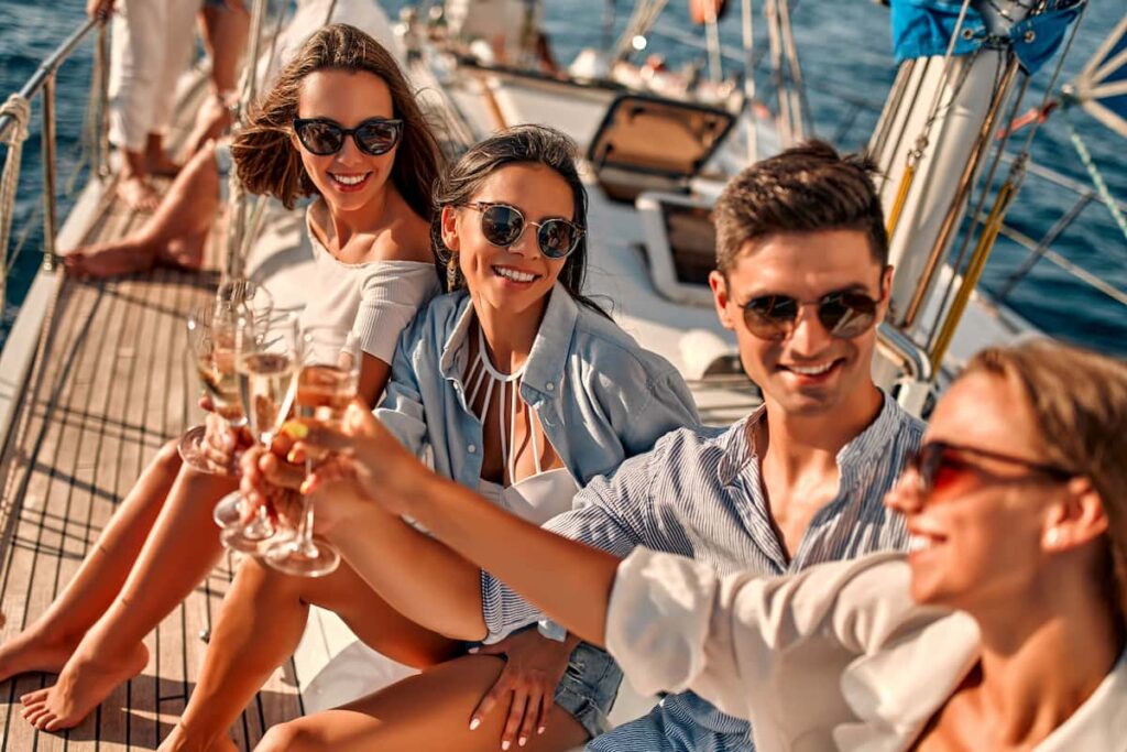 friends having fun on one of the best boat tours in Barcelona, Spain