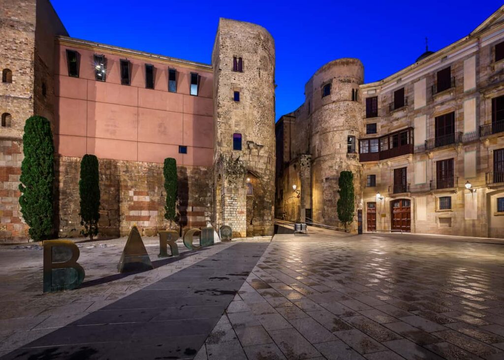 Ancient Roman Gate and Placa Nova in the Morning