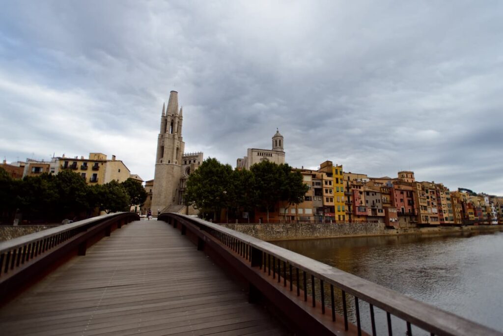 The Bridge of Girona where you can see the Jewish quarters. will make you think of reasons why you must visit Girona from Barcelona.