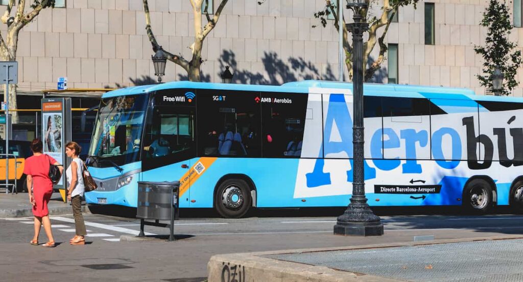 Aerobus airport shuttle buses parked at their terminal in Placa de Catalunya that can be used to ride to Barcelona airports.