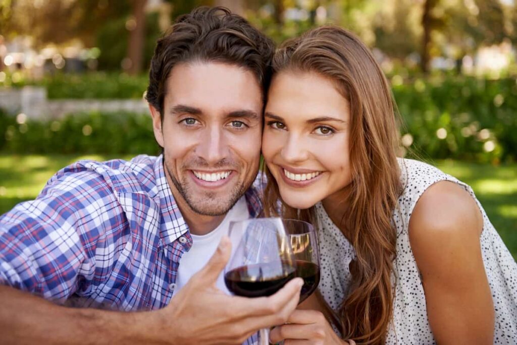 a couple enjoying their wine 