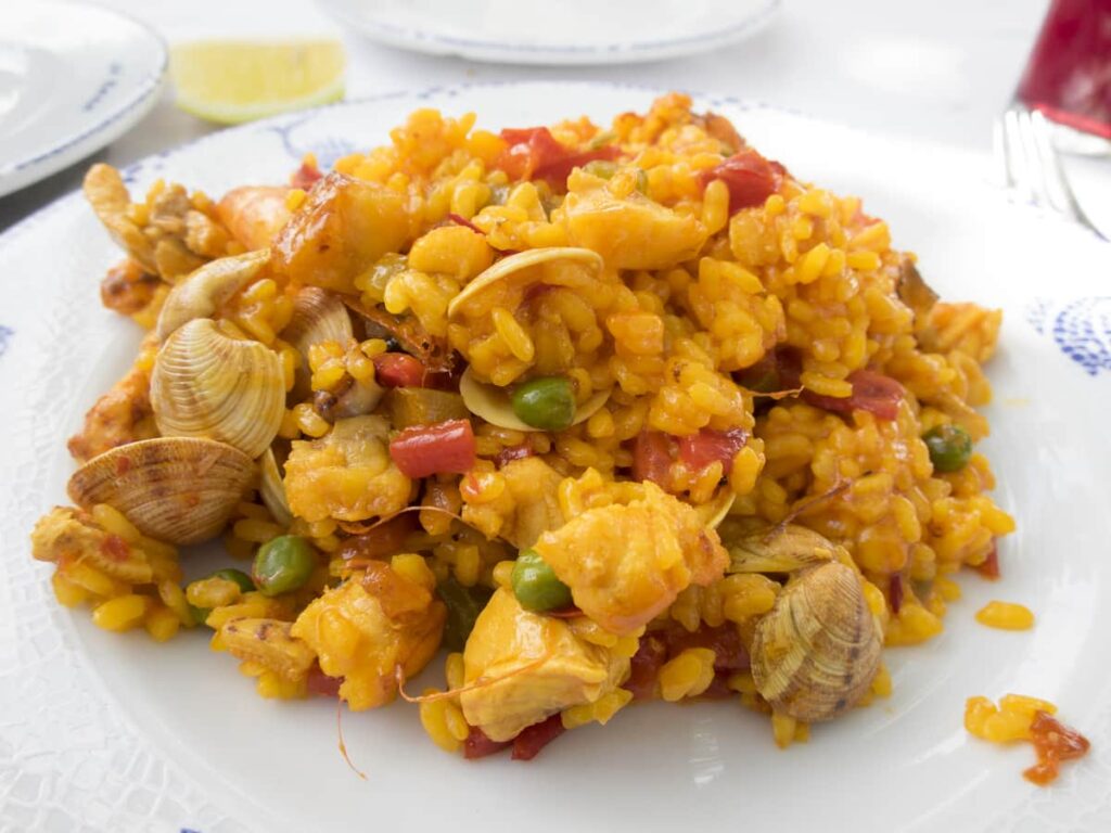 a plate of Paella that you can order when you are travelling in Barcelona as one of Barcelona travel tips