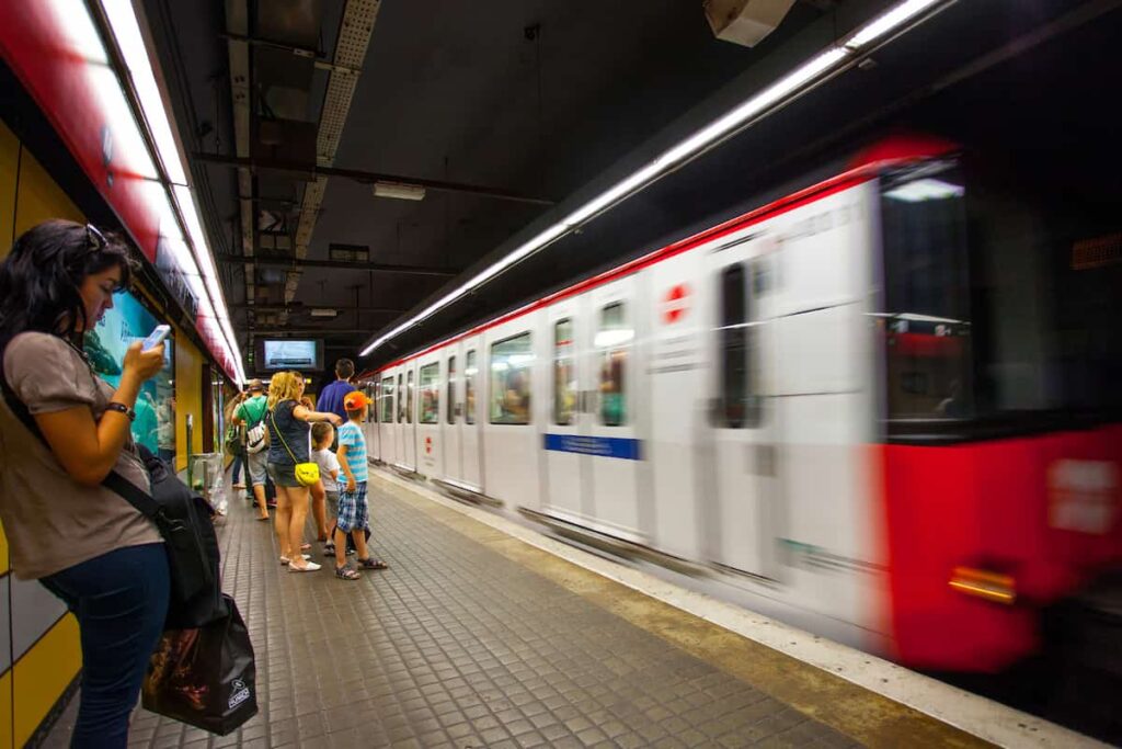 Barcelona metro station with train in motion