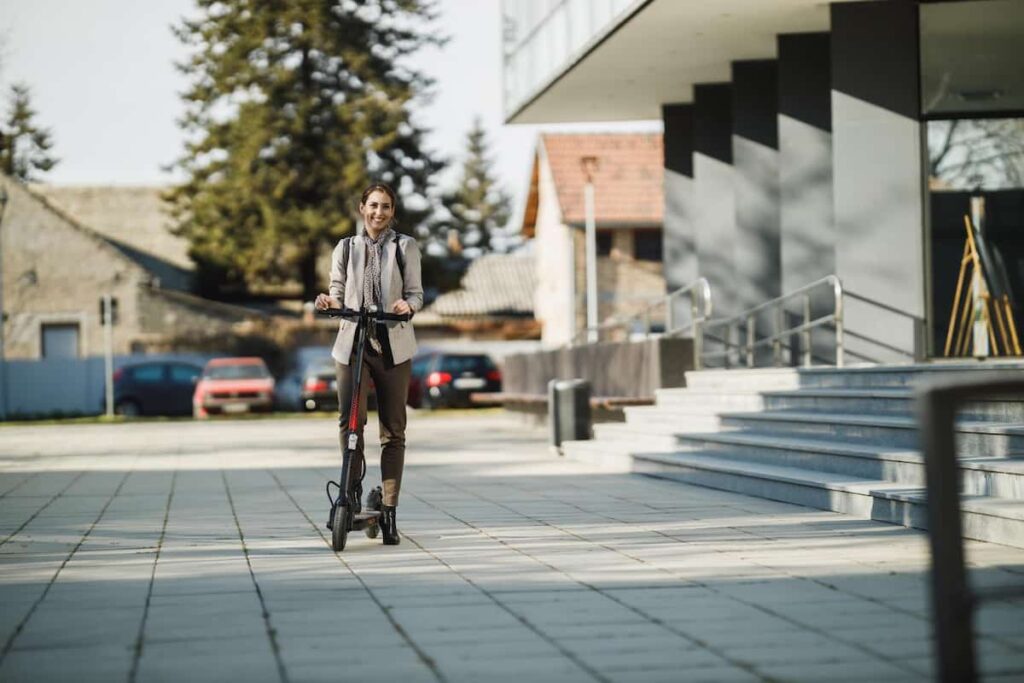 a woman riding a electronic scooter