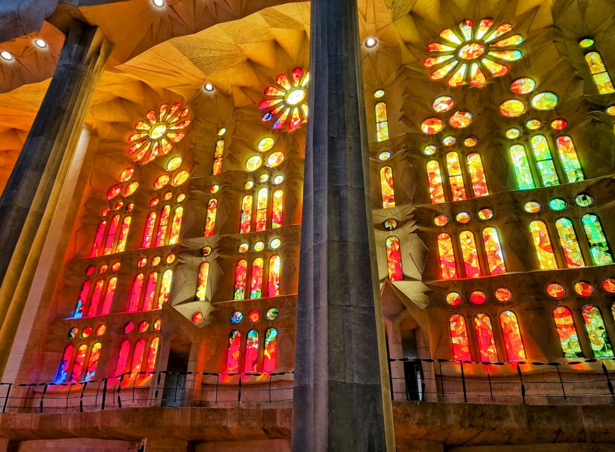 stained glass windows and columns inside the Sagrada Familia