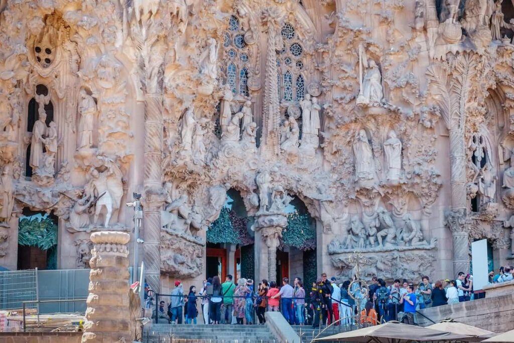 Tourists queuing at the entrance of Sagrada Familia