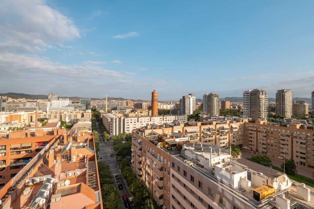 Aerial view of the mesmerizing area of Poble Nou in Barcelona in Spain near the sea with highly developed infrastructure on a sunny warm summer day. One of the best Barcelona neighborhoods.