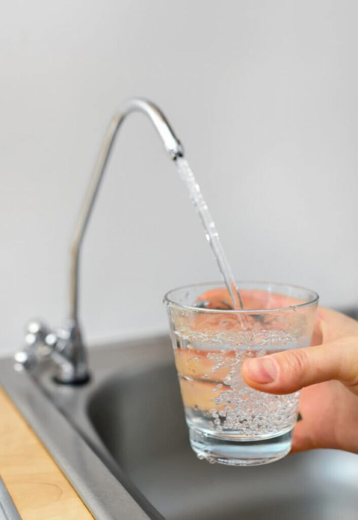 Tap water refilling a glass of water in Barcelona tap water safe to drink.