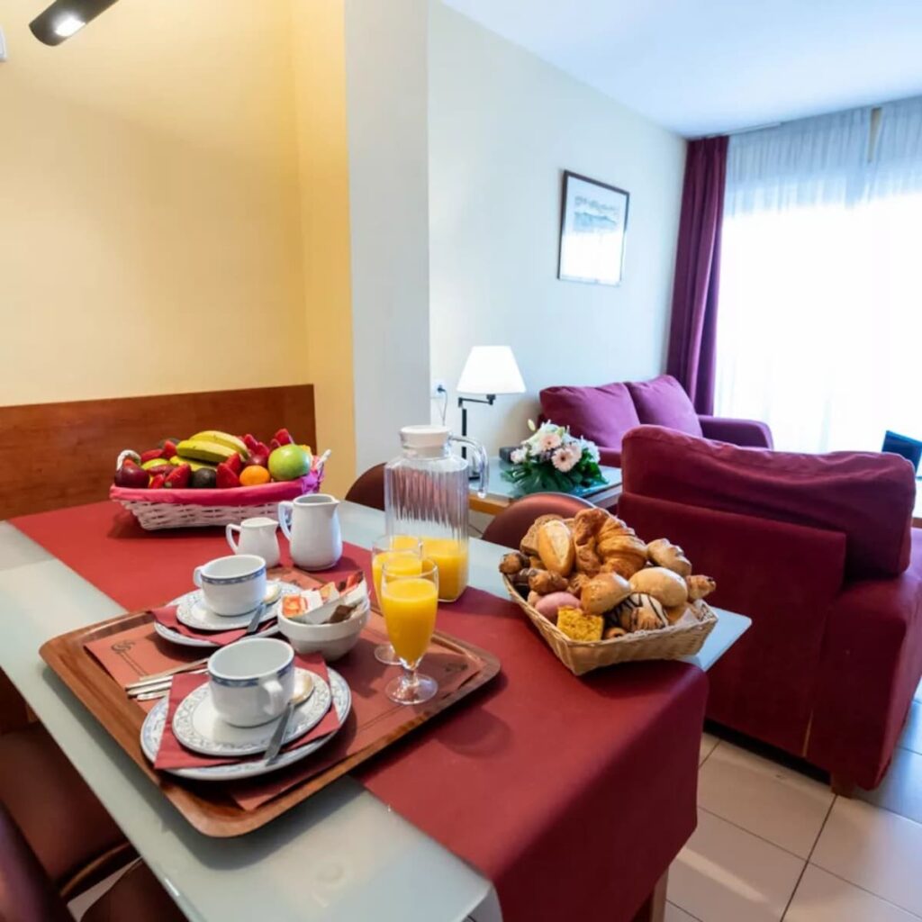 Aparthotel Bertrán  with breakfast on the table