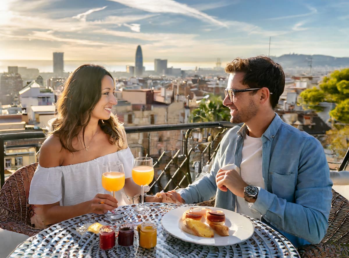 couple having breakfast on the terrace at one of the best Barcelona vacation rentals that has both luxury and is cheap