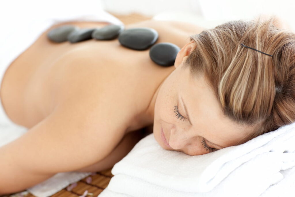 Relaxed woman receiving a Spa treatment in SPA Intercontinental Barcelona. One of the best spas in Barcelona.