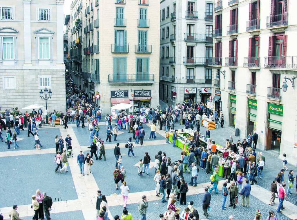 Tourists enjoy city life  in gracia neighborhood in barcelona