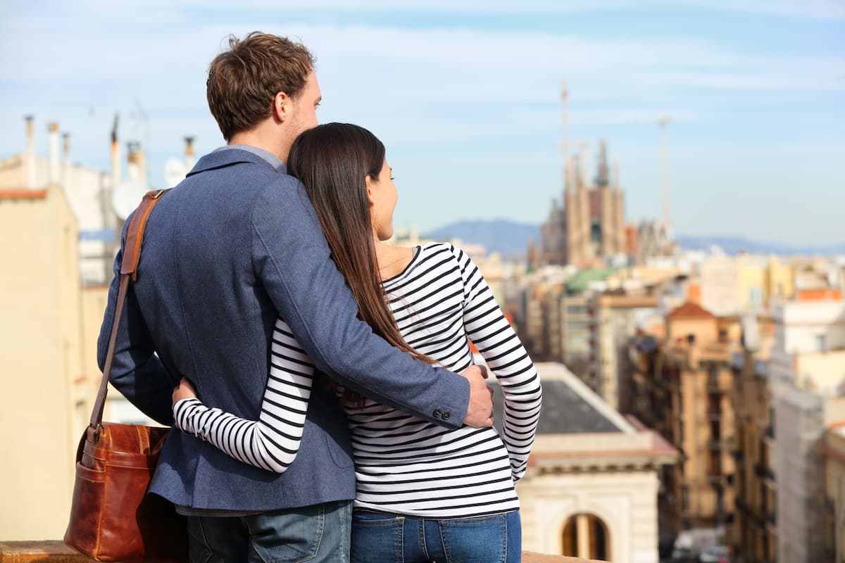 two people at one of the best Barcelona hotels for couples looking at the view from a romantic hotel in Barcelona, Spain