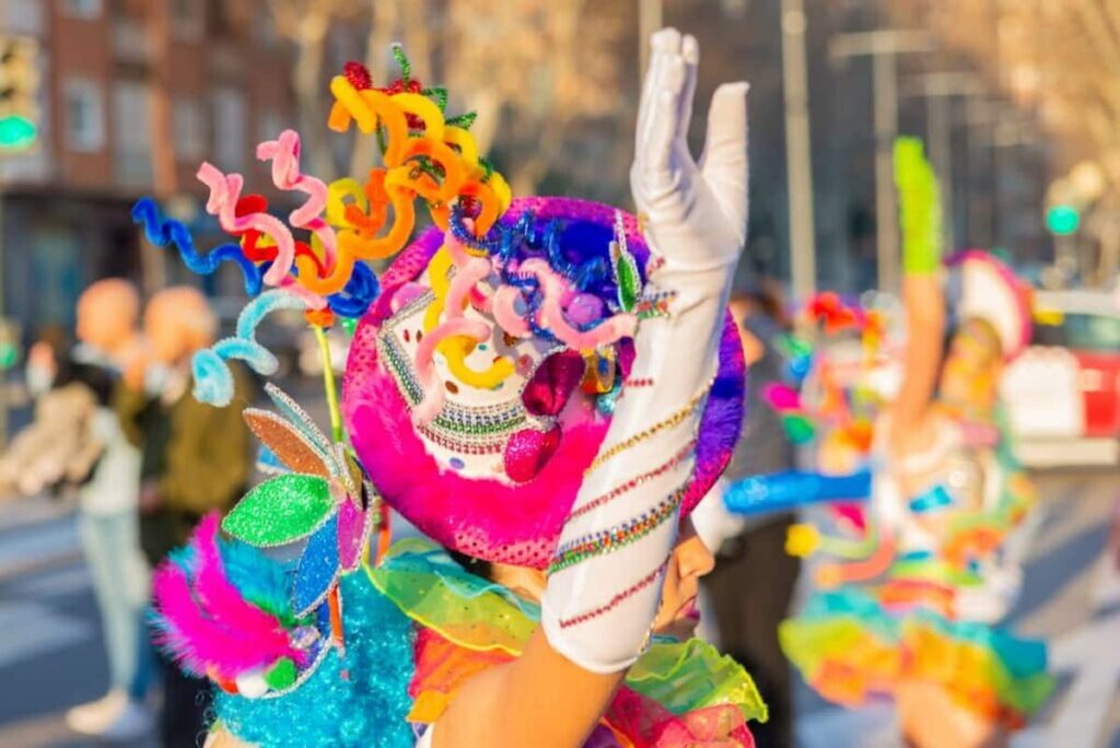 someone wearing a colorful costume for a festival