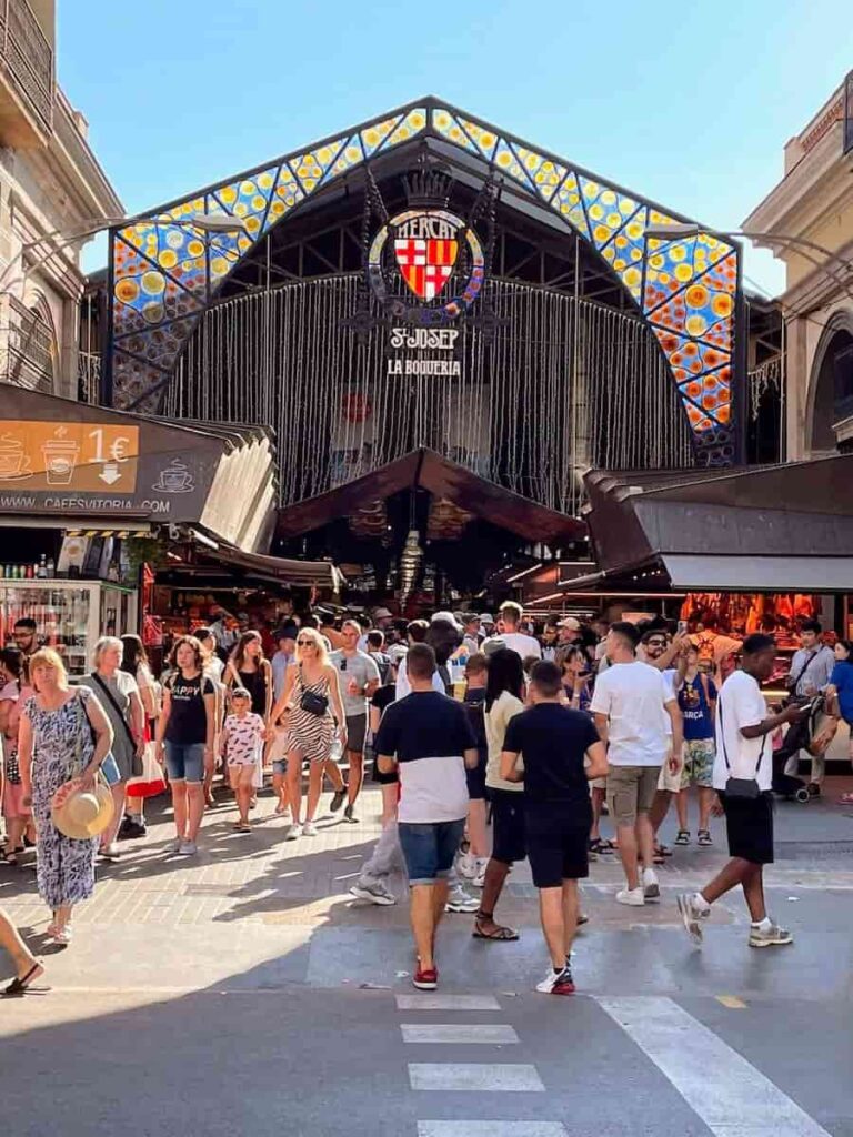 Flock of people in the La Boqueria Market. One of the most famous buildings in Barcelona.