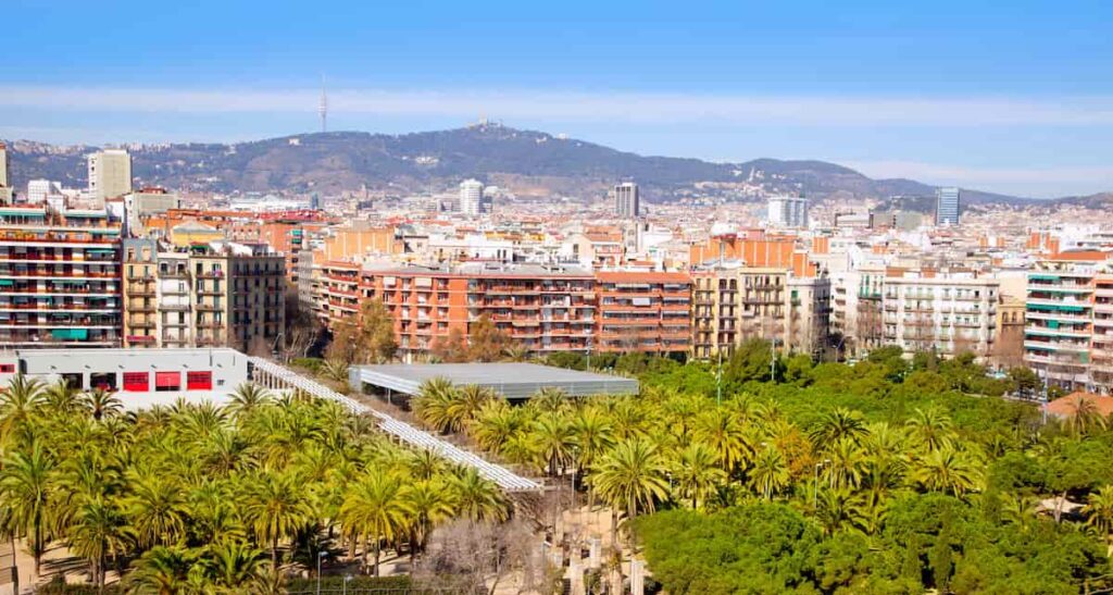 Barcelona Panoramic with Tibidabo mountain under blue sky and beautiful weather. This can help someone to decides where to go. Madrid or Barcelona.