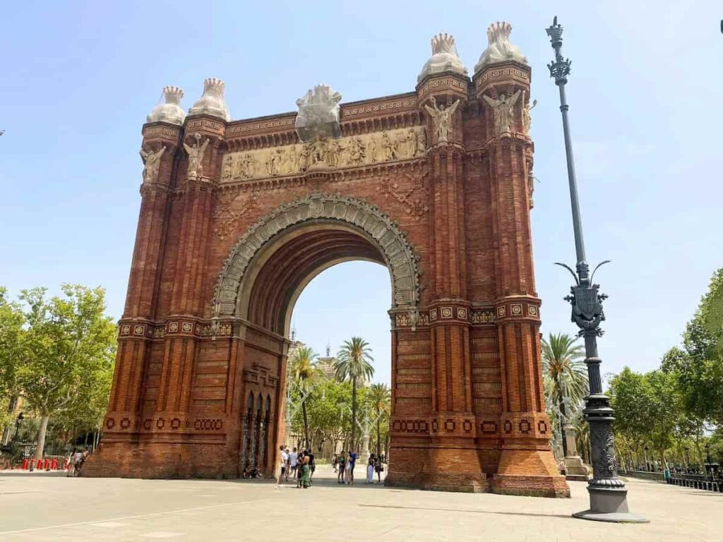 The majestic Arc de Triomf flocked by tourists is one of the best places that has monuments in Barcelona.