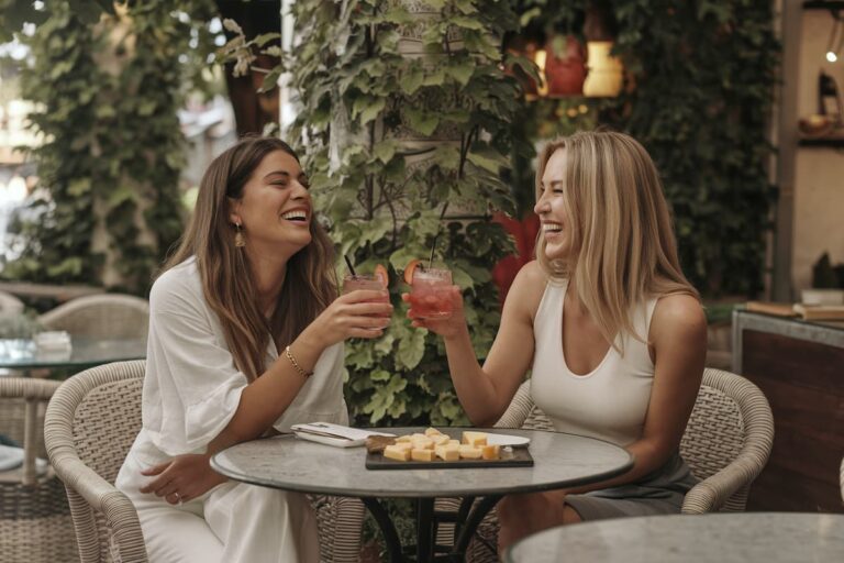 two women at a bar enjoying the best food and drink in Seville, Spain
