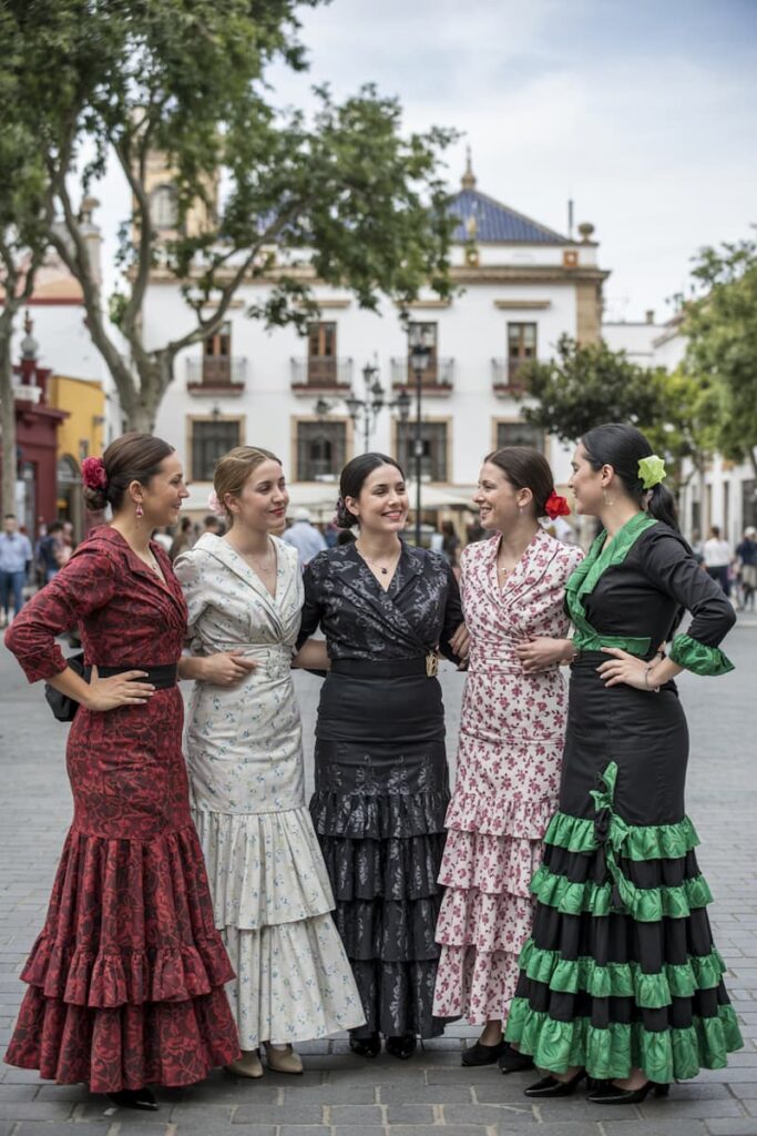 a group of women at Feria de Abril, one of the best times to visit Seville, Spain