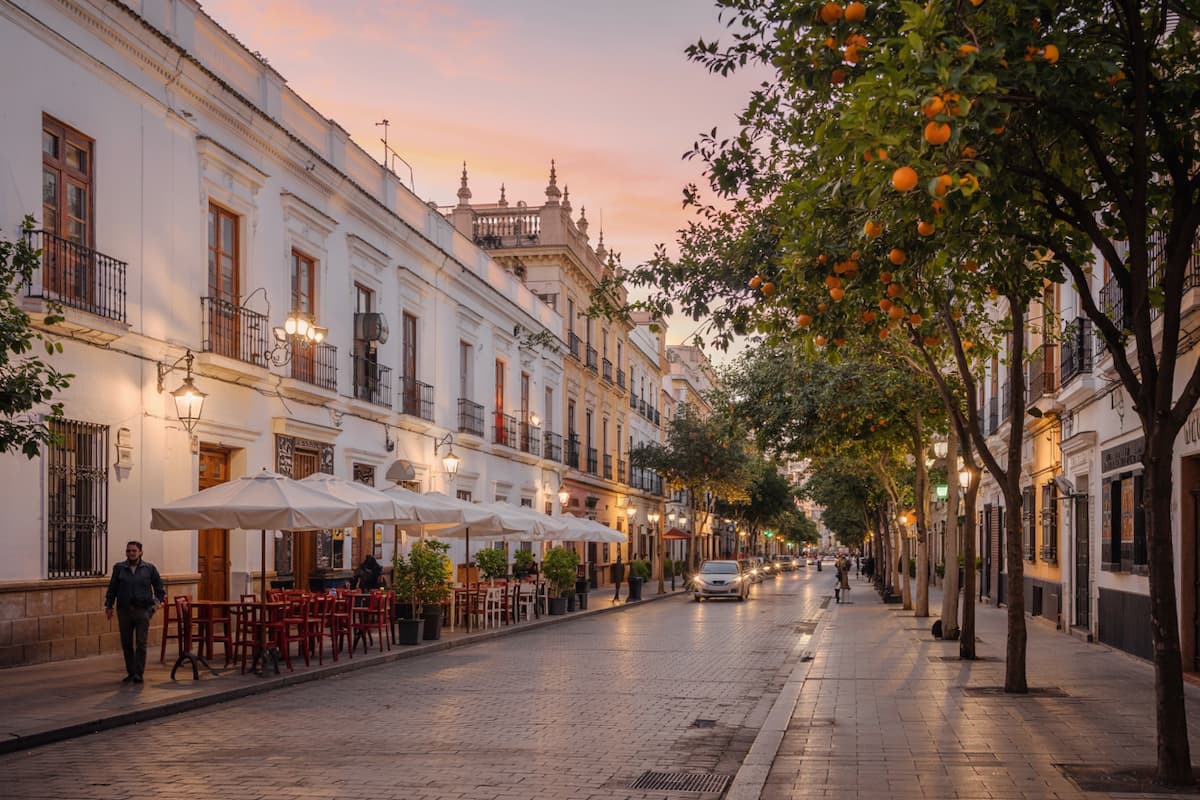 a street with bars during the best time to visit Seville, Spain