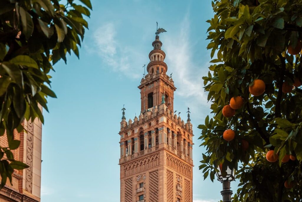 La Giralda tower in Seville framed by orange trees, a historic icon and one of the best places to visit in southern Spain for panoramic views and Gothic-Moorish design