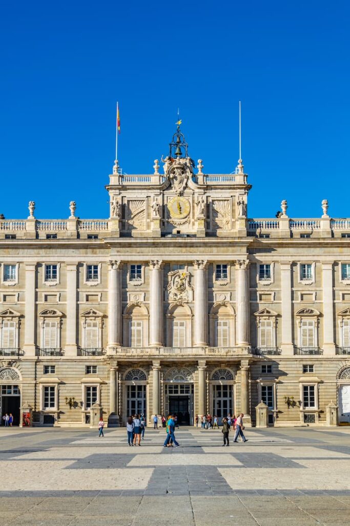 The Royal Palace of Madrid under a clear blue sky, a must-see stop on any one week itinerary in Spain