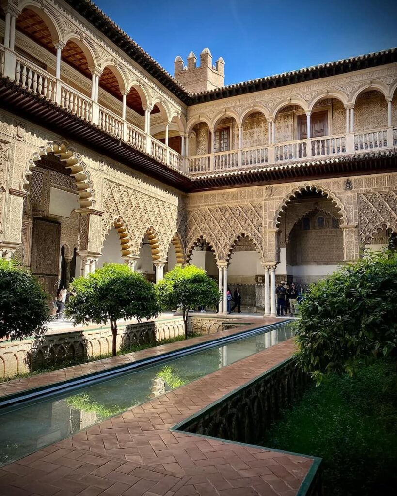 Moorish courtyard and arches at the Royal Alcázar of Seville